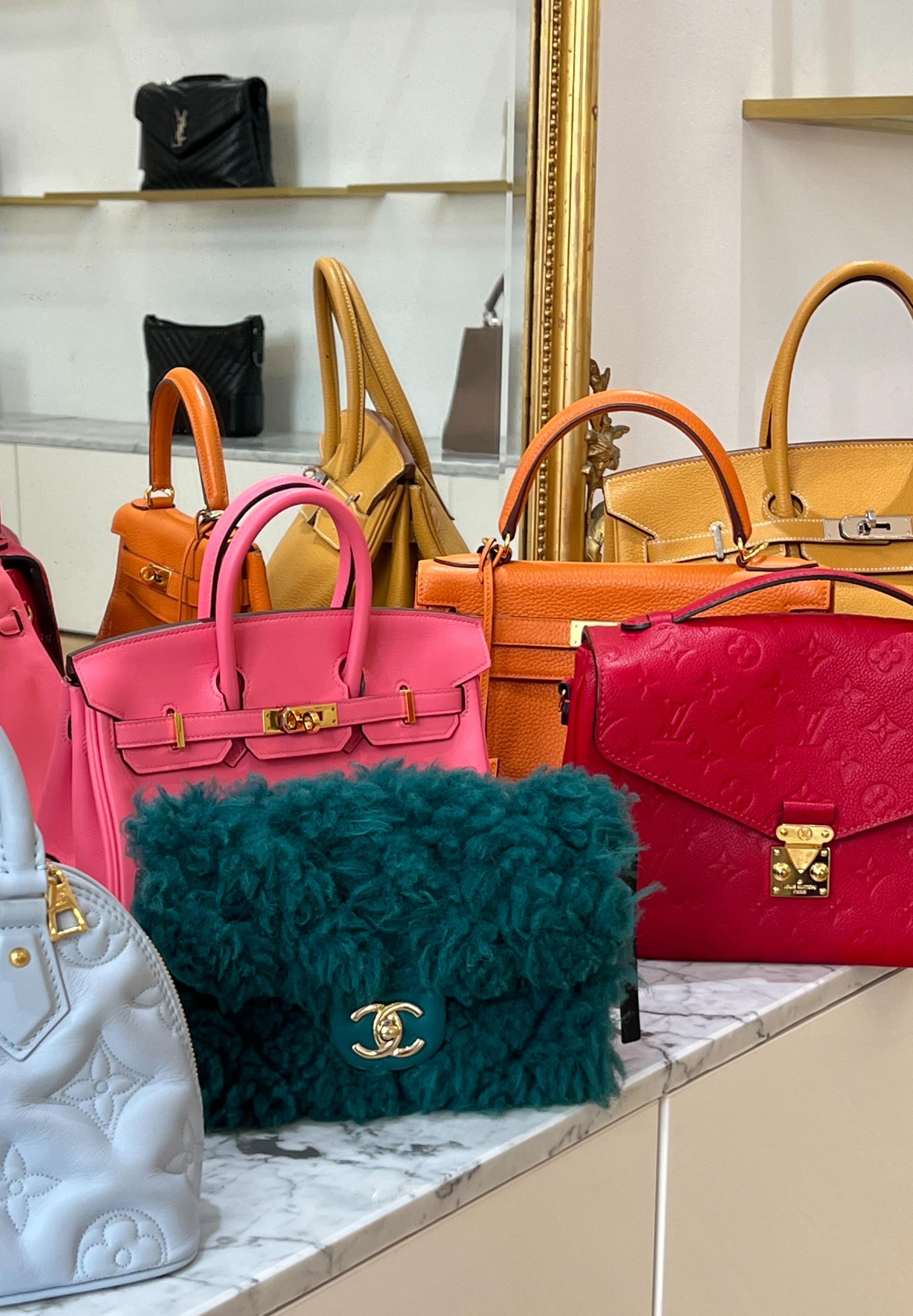 Luxury handbag collection featuring Chanel Classic Flap, Hermès Birkin, and designer accessories